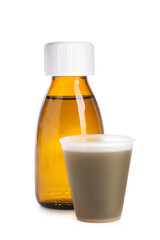 Bottle and measuring cup of cough syrup on white background