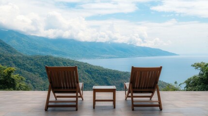 Elderly Asian couple relaxing and enjoying the breathtaking ocean and mountain view from the terrace of their private villa in a tranquil tropical retreat destination