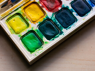 Colorful Watercolor Paint Palette Close-up - Artist Gouache Colors and Creative Art Supplies in Action.
