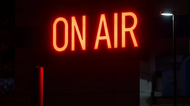 Bright Red Neon ON AIR Sign Illuminates Studio at Night.