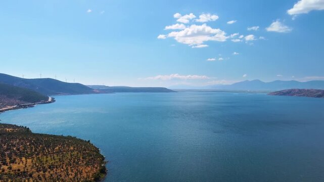 Experience the tranquil beauty of Bafa Lake in Turkey, a stunning natural wonder nestled amidst ancient ruins and lush landscapes. This footage captures the calm waters, picturesque surroundings, and 