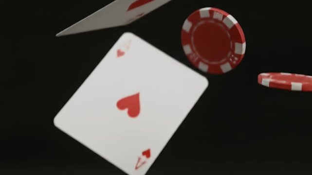 Close up of Aces and Casino Chips on a Black Background.
