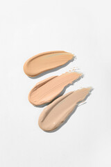 Samples of makeup foundation on light background