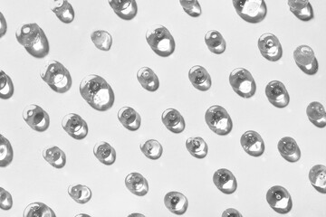 Drops of cosmetic gel on light background