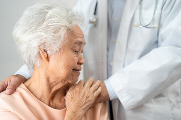Caregiver holding hands Asian elderly woman patient with love, care, encourage and empathy at nursing hospital, healthy strong medical.