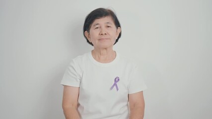 Elderly with Purple Ribbon for Violence, Pancreatic, Esophageal, Testicular cancer, Alzheimer, Epilepsy, Lupus, Crohn, Thyroid,  Sarcoidosis and Fibromyalgia. Awareness month and World cancer day