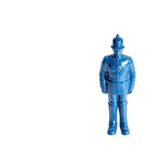 Blue toy soldier, tall hat, on black backdrop