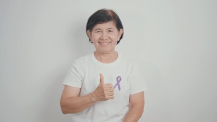 Elderly with Purple Ribbon for Violence, Pancreatic, Esophageal, Testicular cancer, Alzheimer, Epilepsy, Lupus, Crohn, Thyroid,  Sarcoidosis and Fibromyalgia. Awareness month and World cancer day