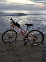 Beach Cycling at Twilight by the Rolling Waves