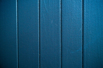 Fototapeta premium Closeup of a blue textured wall panel with vertical lines. High resolution abstract background ideal for design, layout, or architectural concepts.
