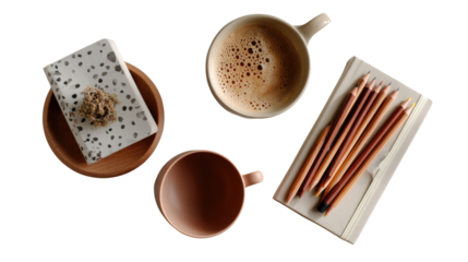 Coffee and Stationery: A cozy top-down composition presents a creative workspace with coffee cup and drawing pencils with notebook and design journal, all arranged in a visually pleasing composition.