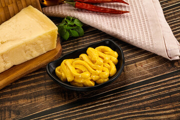 Yellow cheese sauce in the bowl