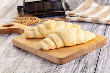 Raw uncooked croissant for bake