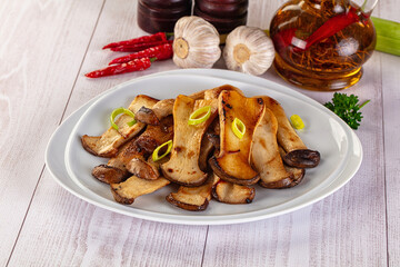 Roasted eringi mushrooms in the plate