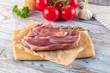 Raw lamb steak with bone
