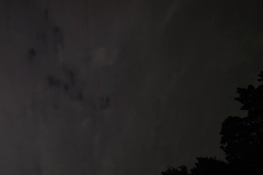Dark night sky with clouds and distant stars above, the sky over W&uuml;sting, 27798 Hude, Germany