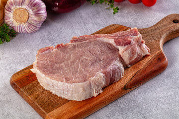 Raw pork steak with bone