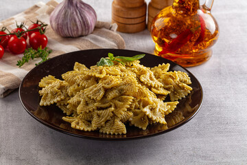 Italian green pasta farfalle with pesto