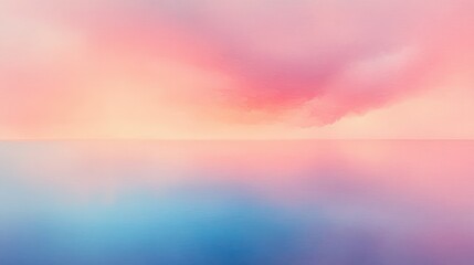 Soft gradient sky blending warm pink and peach tones with calm reflective blue water below creating a serene and peaceful atmosphere