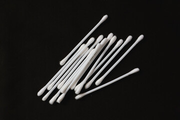 Cotton buds for health purposes. Taken on a black background.