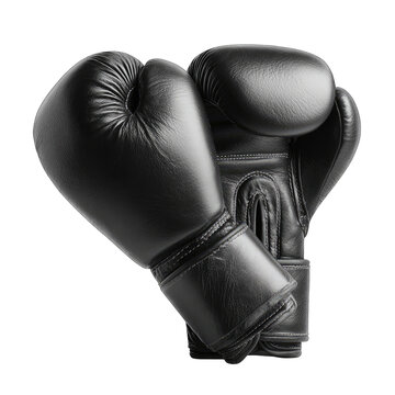 Pair of shiny black boxing gloves on dark, contrasting ground