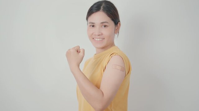 Adult Woman with bandage after received vaccine. Vaccination and Immunization for Influenza, HPV, Zoster, IPD, DTP or Diphtheria, Tetanus and Pertussis, MMR, Hepatitis B, Covid and Varicella vaccine