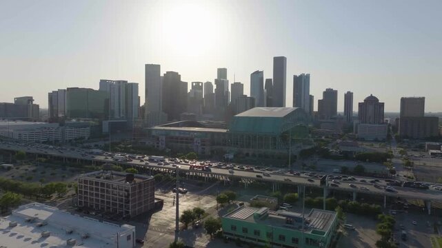 Aerial view of traffic in front of the Daikin Park, golden hour in Houston, USA