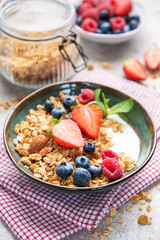Granola bowl with fresh berries yogurt and nuts