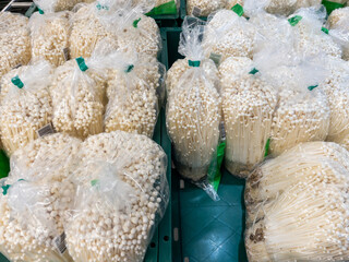 Fresh Enoki Mushrooms in Market Display.