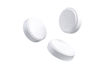 Three white, round tablets levitate, slightly textured