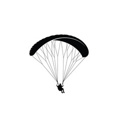 silhouette of a paraglider in the air