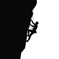 silhouette of a climber scaling a rock face