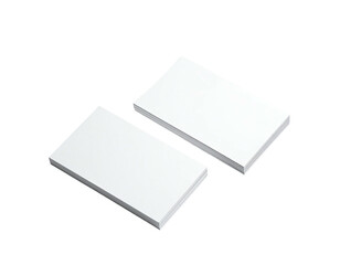 Two stacks of plain white rectangular cards or paper, slightly tilted, dark background