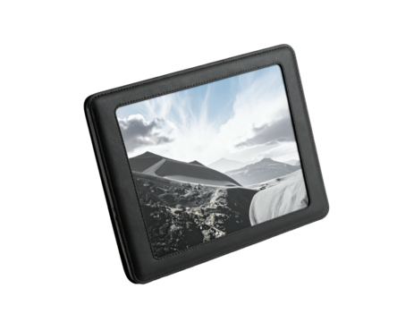 Black tablet device displays a landscape scene with mountains and a bright sky