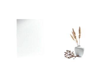 White framed artwork beside a vase with dried floral arrangement