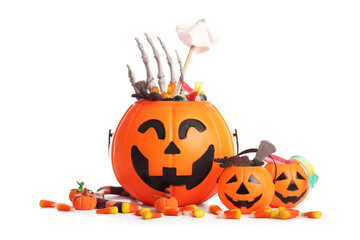 Cauldrons in shape of pumpkin with candies for Halloween and skeleton hand isolated on white background