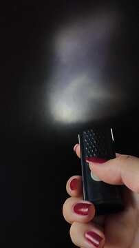 Flashlight and a beam of light in the dark. Flashlight ray in the darkness. Torchlight in the darkness