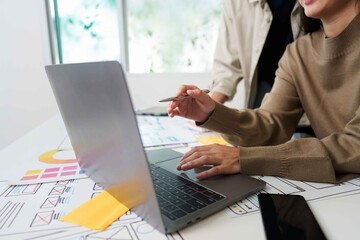 Collaborative UX UI Design Session with Laptop and Sketches