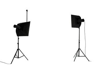 Two photography lighting stands with black softboxes against a dark background