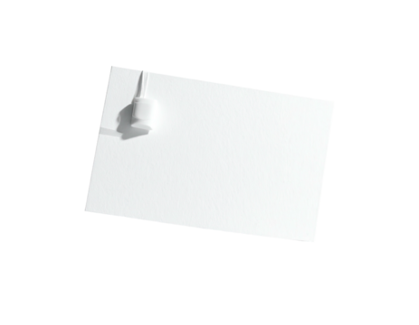 Plain white paper card attached to a surface with a pin, isolated on black