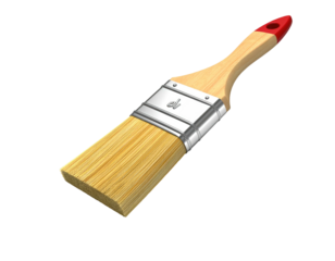 A flat paintbrush with a red handle against a black background, lit to show details