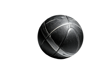 A textured, detailed basketball sits centered in a darkened, dramatic setting