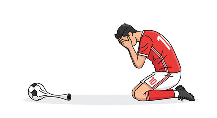 Despairing footballer kneels in devastation after a deflated soccer ball signals defeat for his team in the final match of the tournament