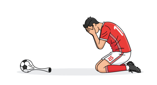 Despairing footballer kneels in devastation after a deflated soccer ball signals defeat for his team in the final match of the tournament