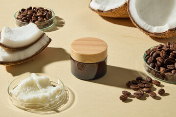High view showing coconuts, coffee beans, and skincare cream jar. Highlighting natural raw materials used for beauty products with hydrating and exfoliating effects. Cosmetic mockup for