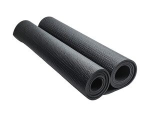 Two black rolled yoga mats on a black background, ready for exercise