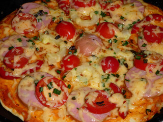Appetizing Skillet Pizza Close-up with Melty Cheese