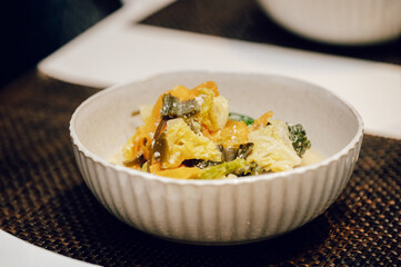 Healthy Japanese tofu and vegetable hot pot served in a ceramic bowl — soy milk nabe dish