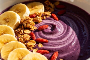 Colorful Smoothie Bowl with Banana, Granola, and Goji Berries