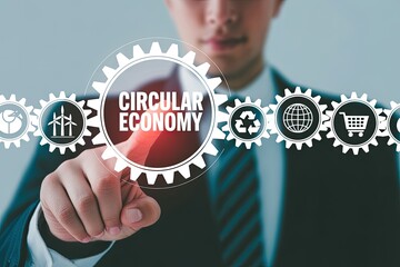 Businessman's finger touching circular economy gears with eco-friendly business symbols for sustainability